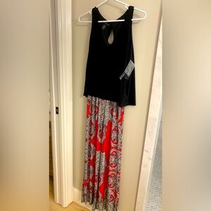 Stretchy black tank pantsuit . Paisley pattern flare leg pants